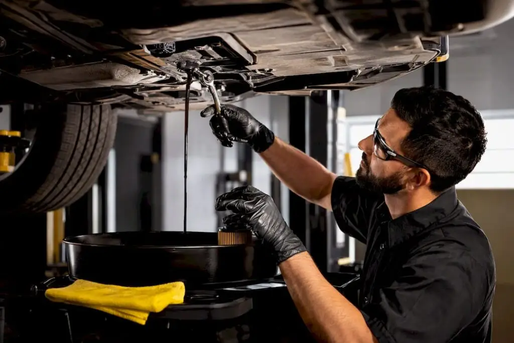 Technician performing a first oil change